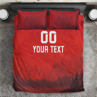 Red duvet set with 'DO YOUR TEXT' print and forest-mountain scene; two matching pillows