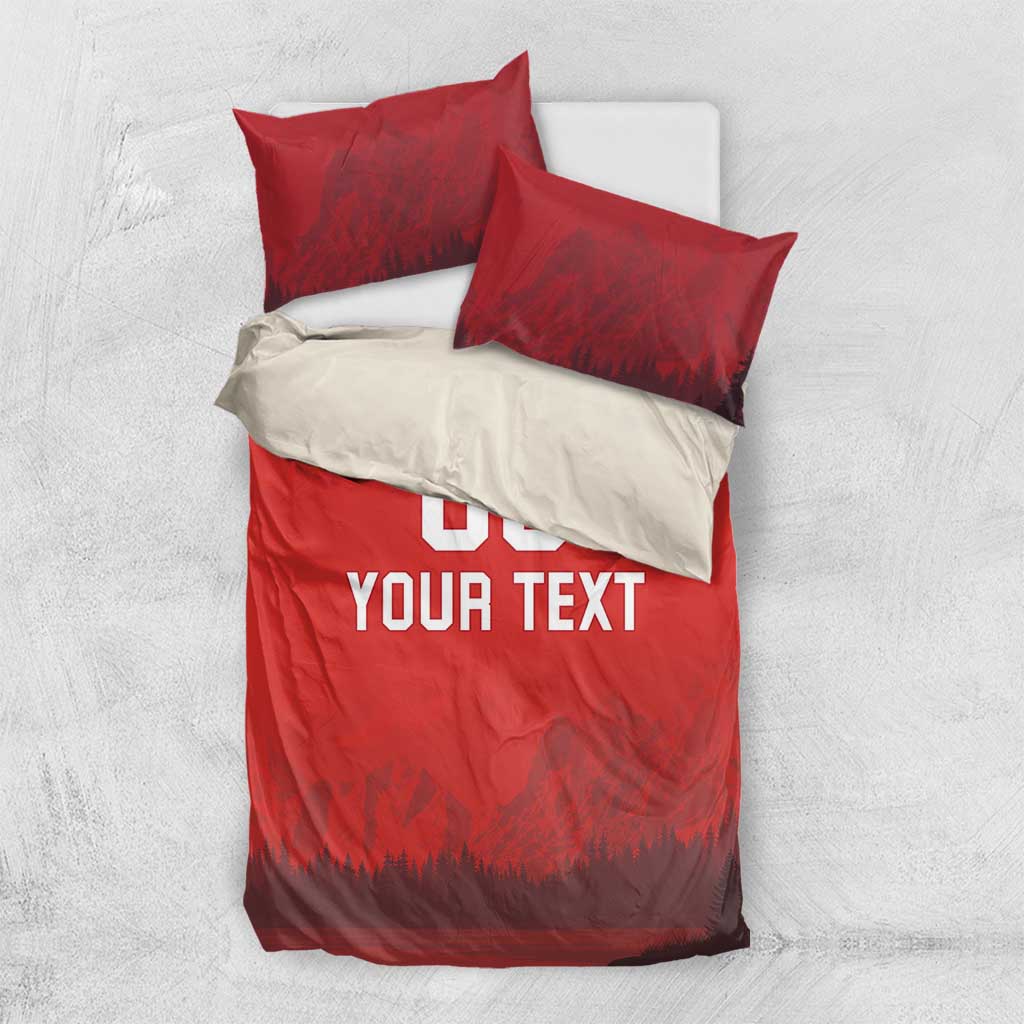 Red duvet set with 'DO YOUR TEXT' print and forest-mountain scene; two red pillow shams