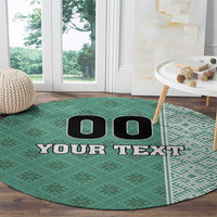 Round green football carpet with 'YOUR TEXT' and black icon pair on field