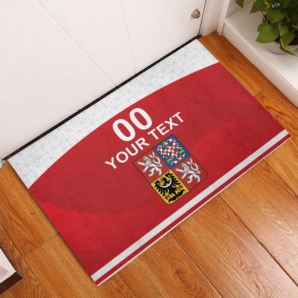 Red rubber doormat featuring Czech crest and “00 YOUR TEXT” with white frame border
