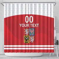 Red shower curtain with white stripes, crest and 'YOUR TEXT' text, hanging on hooks