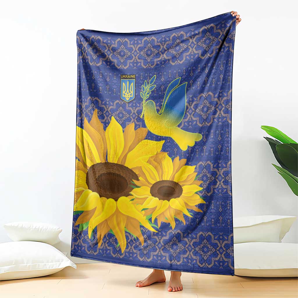 Blue sunflower blanket with peace dove and folk-style border pattern