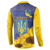 Blue and yellow button sweatshirt with Ukraine crest, dove, and sunflower print on back
