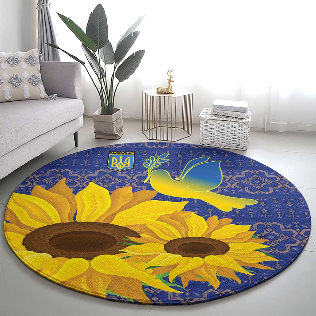 Blue round rug with large sunflower heads and green dove over geometric trim