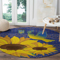 Blue round rug with Ukraine crest, yellow flowers, and green dove motif