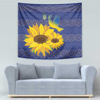 Blue folk tapestry with sunflowers and peace dove motif, decorative border