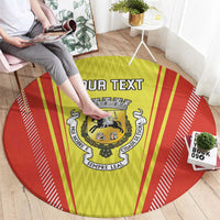 Round red and yellow rug with crest logo and bold 'YOUR TEXT' lettering