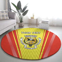 Round red and yellow rug featuring crest emblem and 'YOUR TEXT' banner