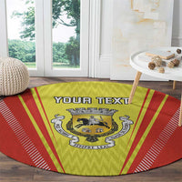 Round red and yellow rug with crest logo and 'YOUR TEXT' text across center