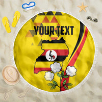 Yellow round beach blanket with white fringe, Uganda map crowned crane, clouds and 'YOUR TEXT'.