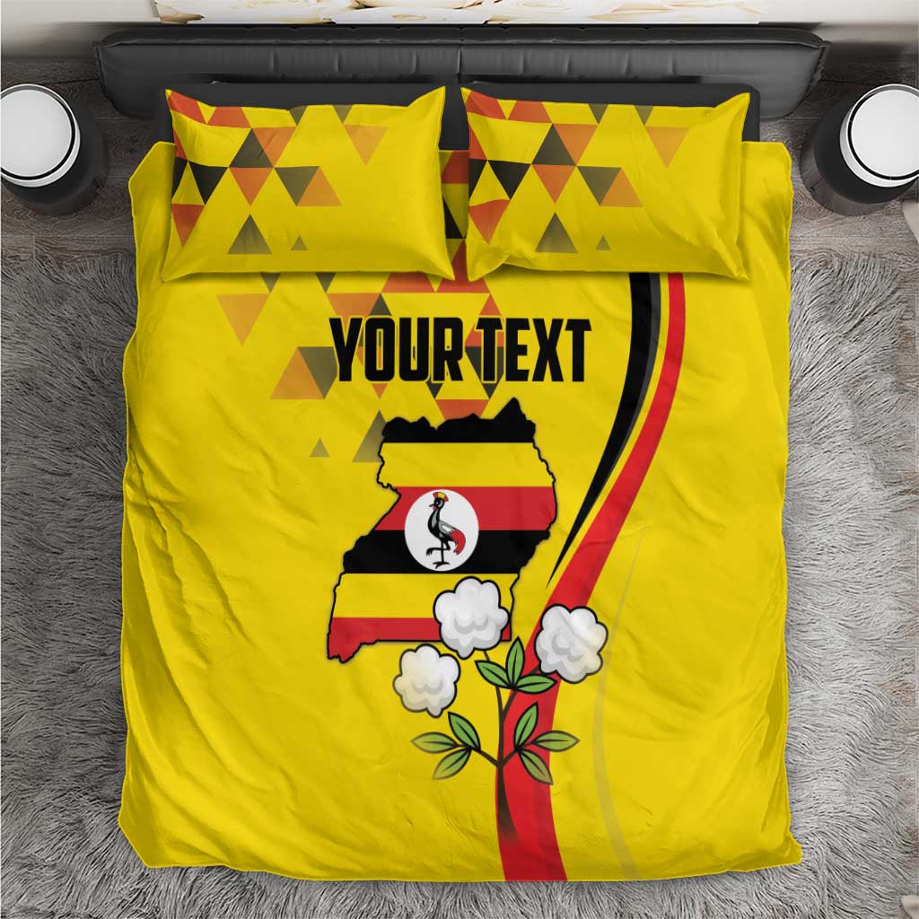 Yellow duvet cover and two pillowcases with Uganda map, crane graphic, and flowers