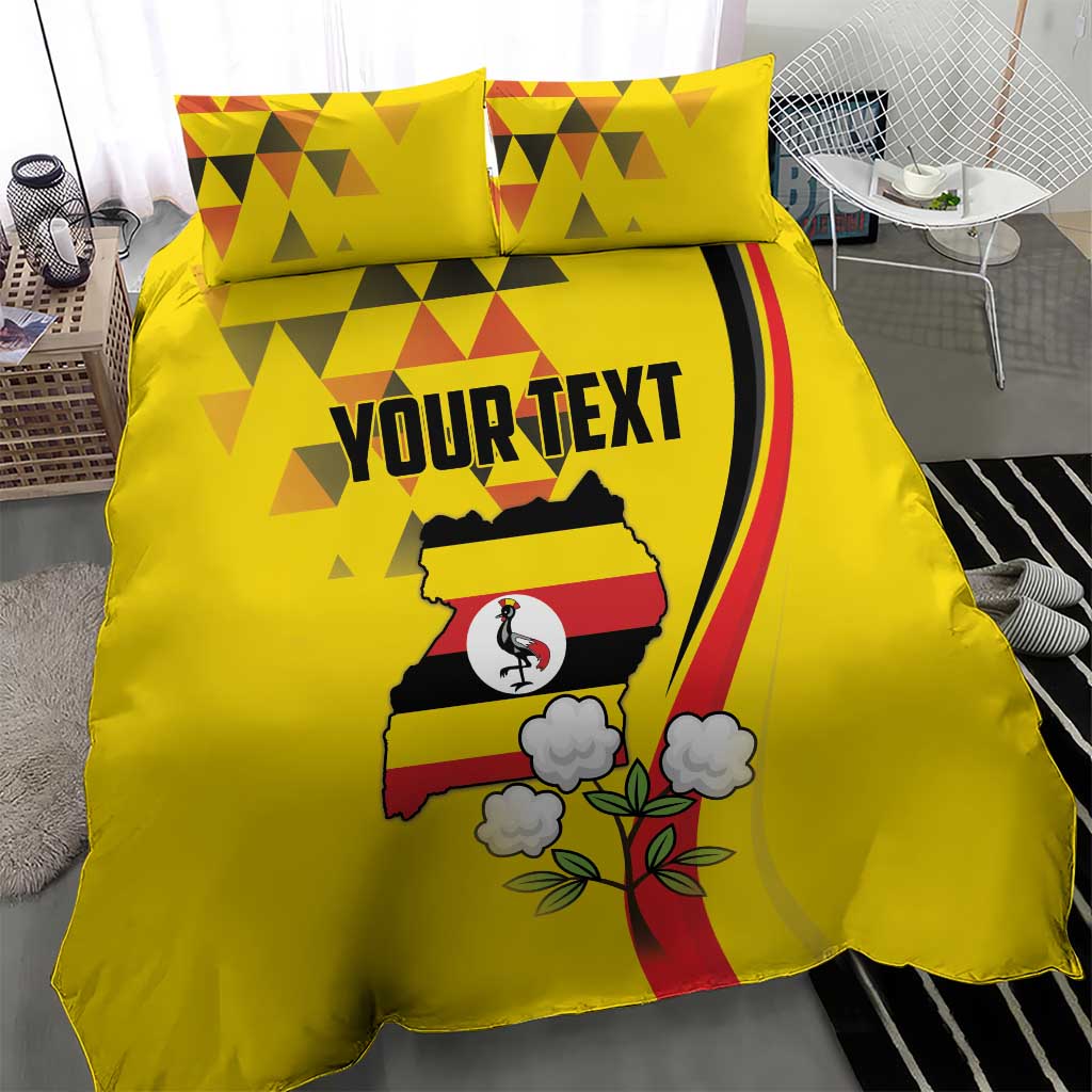 Yellow duvet cover and pillowcases featuring crowned crane and Uganda crest with flowers