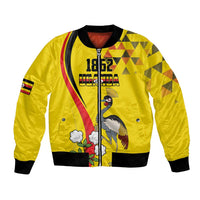 Yellow bomber jacket with front zipper, 1862 text, crowned crane and floral graphic