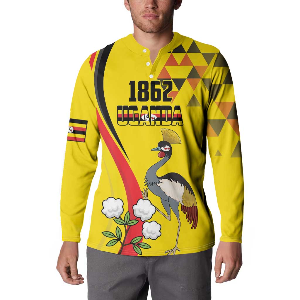 Yellow long-sleeve button sweatshirt with 1852 Uganda crane bird front graphic on model