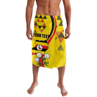 Yellow lavalava with geometric print and YOUR TEXT panel, bird emblem, red and green accents