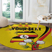 Yellow round area rug with 'YOUR TEXT' banner, crane bird, and clouded tree motif.