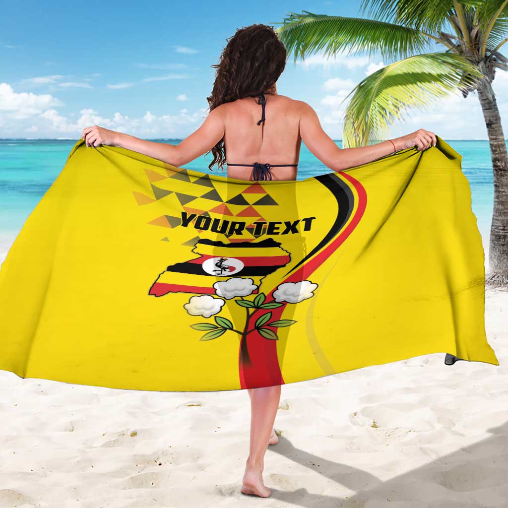 Yellow sarong wrap with Uganda flag, crowned crane, and floral accents on the back print