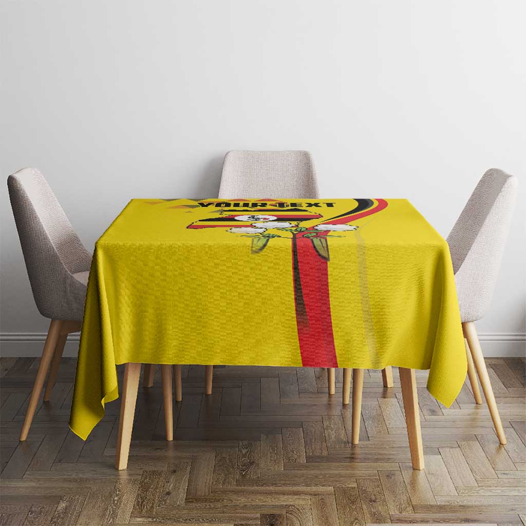 Yellow tablecloth with crowned crane emblem centered on red vertical stripe