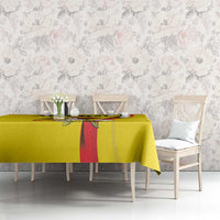 Yellow tablecloth with red stripe and crowned crane bird design