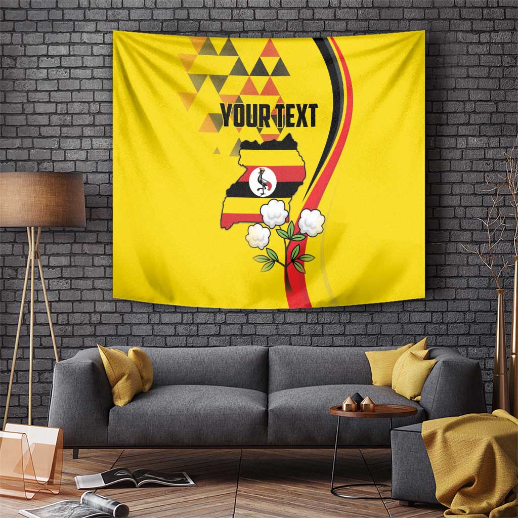 Yellow tapestry with Uganda silhouette, bird-in-circle icon, flower accents, and 'YOUR TEXT'