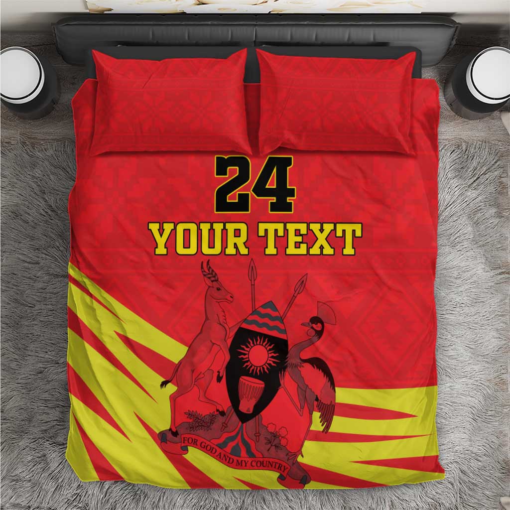 Red bedding set with kente-style stripes, Coat of Arms graphic, and “24 YOUR TEXT”