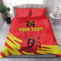 Red duvet and pillow set with “24 YOUR TEXT” text, kente stripes, and Coat of Arms