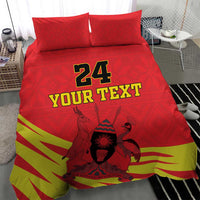 Red bedding set featuring “24 YOUR TEXT” and Coat of Arms with kente-style striped hem