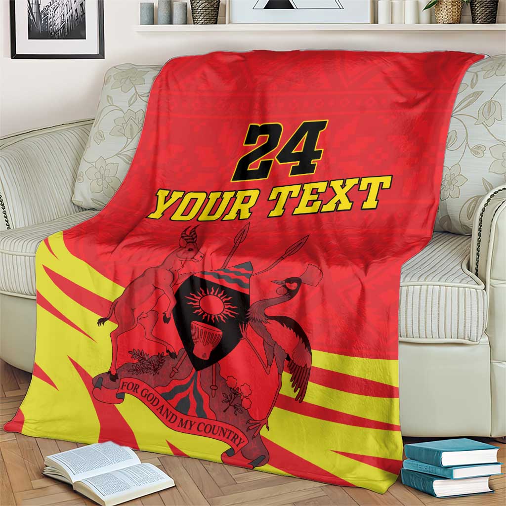 Red blanket with yellow stripe accents, Uganda coat of arms and 24 YOUR TEXT print