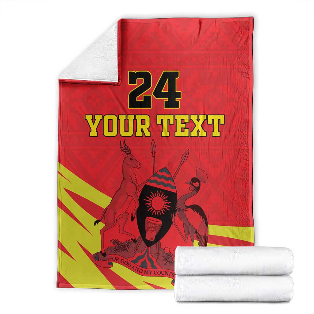 Folded red blanket with yellow stripes, Uganda coat of arms and 24 YOUR TEXT print