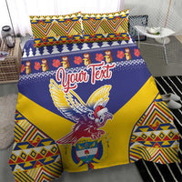 Personalized duvet and pillow set with blue, yellow geometric stripes and condor motif