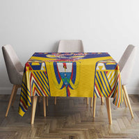 Rectangular geometric blue and yellow tablecloth on dining table with four chairs