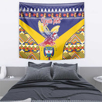 Blue Christmas tapestry featuring a condor emblem and colorful geometric trim.