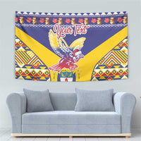 Blue Christmas wall tapestry with condor figure, geometric accents, and ribbon text.