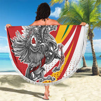 Red round beach blanket with fringe, “YOUR TEXT” and Lithuanian crest graphic held up