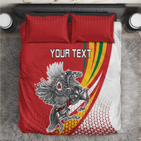 Close view of red and white duvet bedding set with “YOUR TEXT” and horse crest