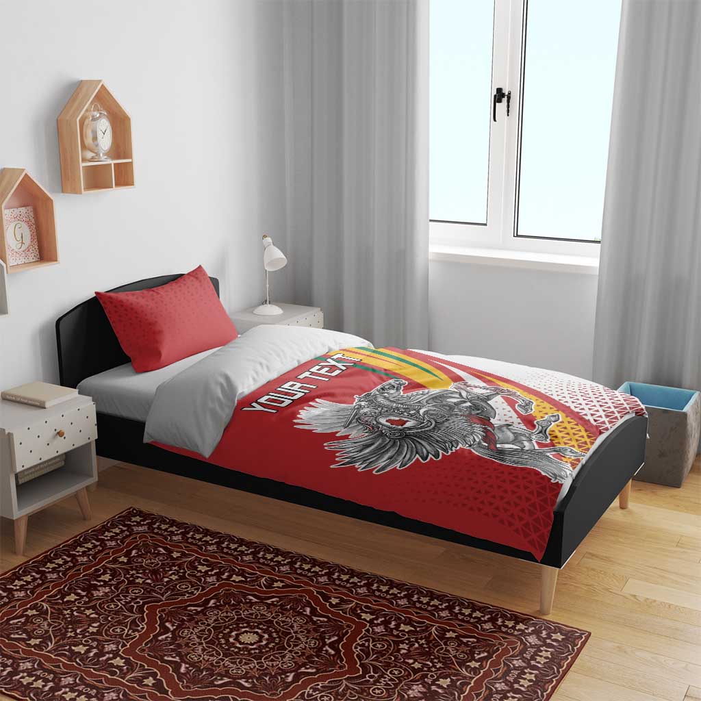 Red and white duvet bedding set with red pillowcases and “YOUR TEXT” on bed