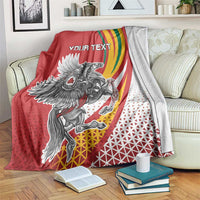 Red personalized throw blanket with crest graphic, rainbow swoosh, and 'YOUR TEXT' panel