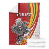 Red personalized throw blanket with crest graphic, rainbow swoosh, and 'YOUR TEXT' panel