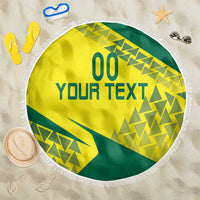 Round yellow and green beach blanket with fringe edge and geometric print