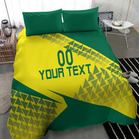 Green and yellow bedding set with geometric triangle pattern and two matching pillowcases
