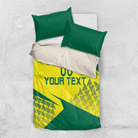 Green and yellow bedding set with geometric triangle pattern, includes duvet and two pillowcases