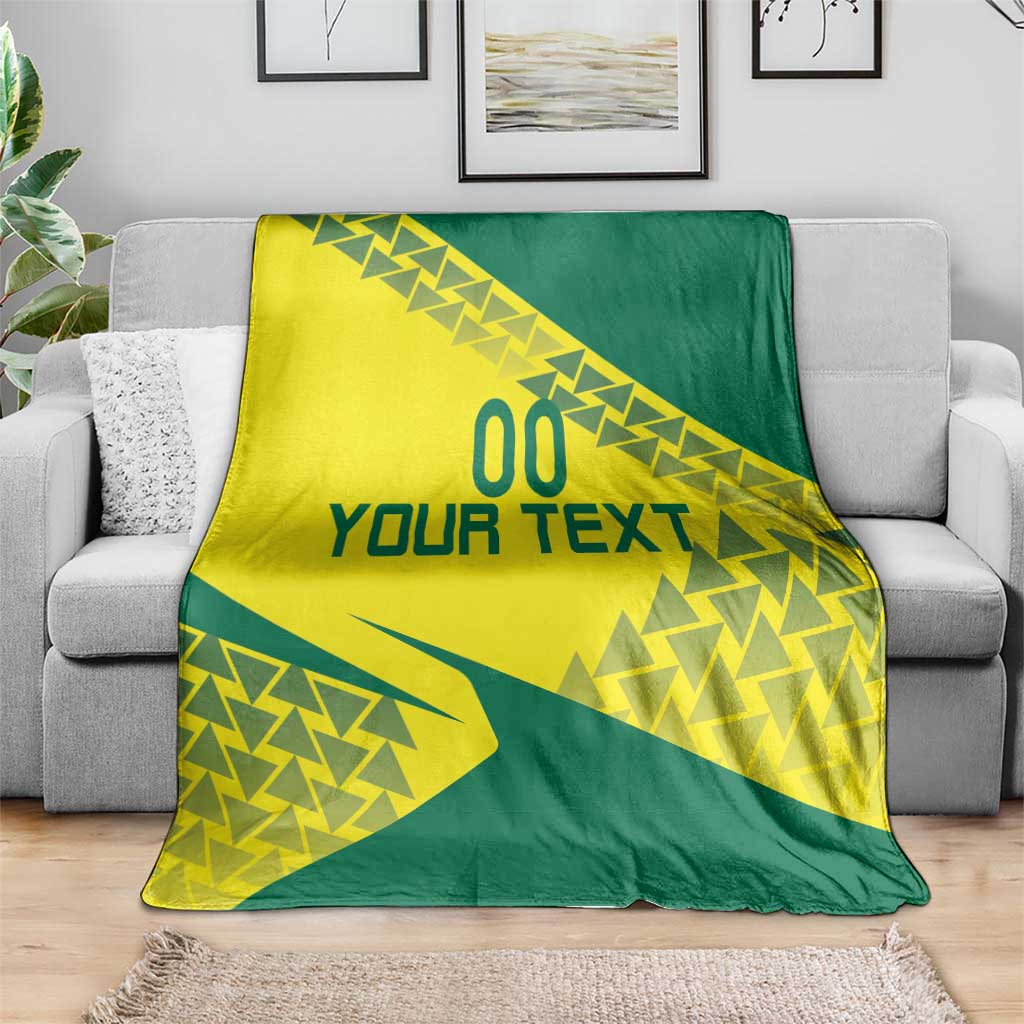Volleyball blanket in yellow and green with 'YOUR TEXT' geometric pattern on a couch