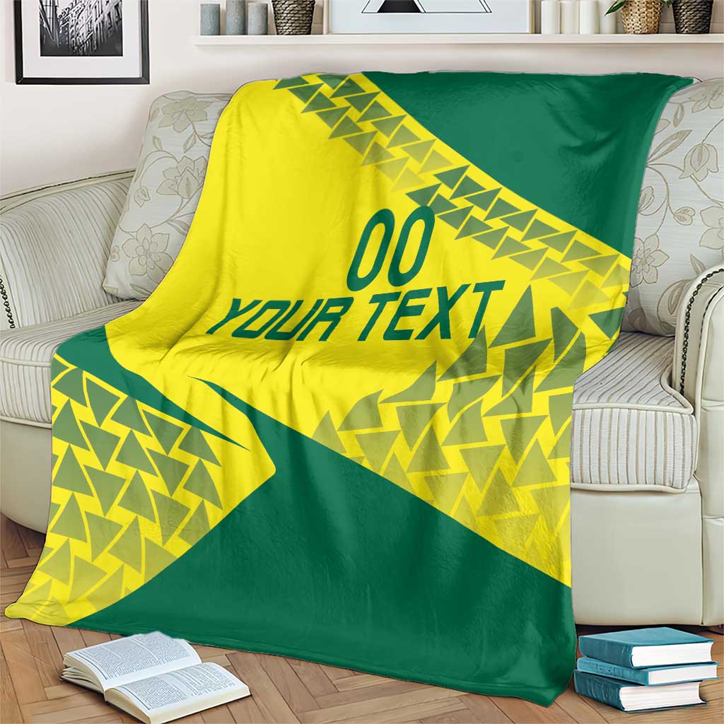 Volleyball blanket yellow and green with 'YOUR TEXT' and triangle pattern draped on sofa