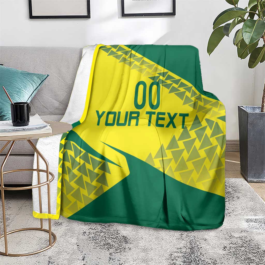 Volleyball blanket in yellow and green geometric graphic with 'YOUR TEXT' draped on chair