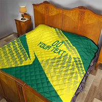 Yellow and green Lithuania-themed quilt on a bed with quilted stitching and “YOUR TEXT”