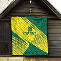 Yellow and green custom Lithuania quilt displayed outdoors with “YOUR TEXT” and quilted squares