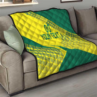 Yellow and green custom Lithuania quilt draped over a sofa, quilted pattern and “YOUR TEXT”