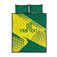 Yellow and green quilt bed set with geometric design, 'YOUR TEXT' graphic, and two pillows