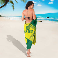 Green and yellow volleyball sarong with geometric 'YOUR TEXT' print, tied at waist
