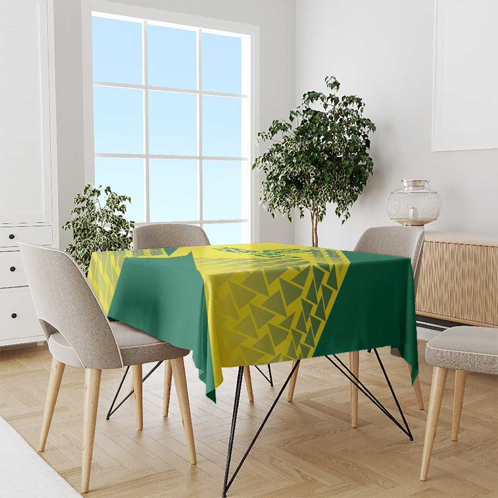 Green and yellow geometric volleyball tablecloth covering a dining table